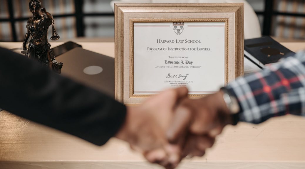 selective focus photo of a diploma on a frame