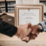 selective focus photo of a diploma on a frame
